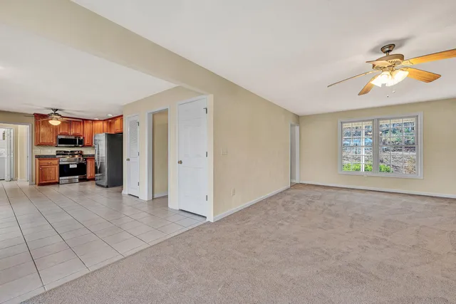 a view of a livingroom with furniture and window