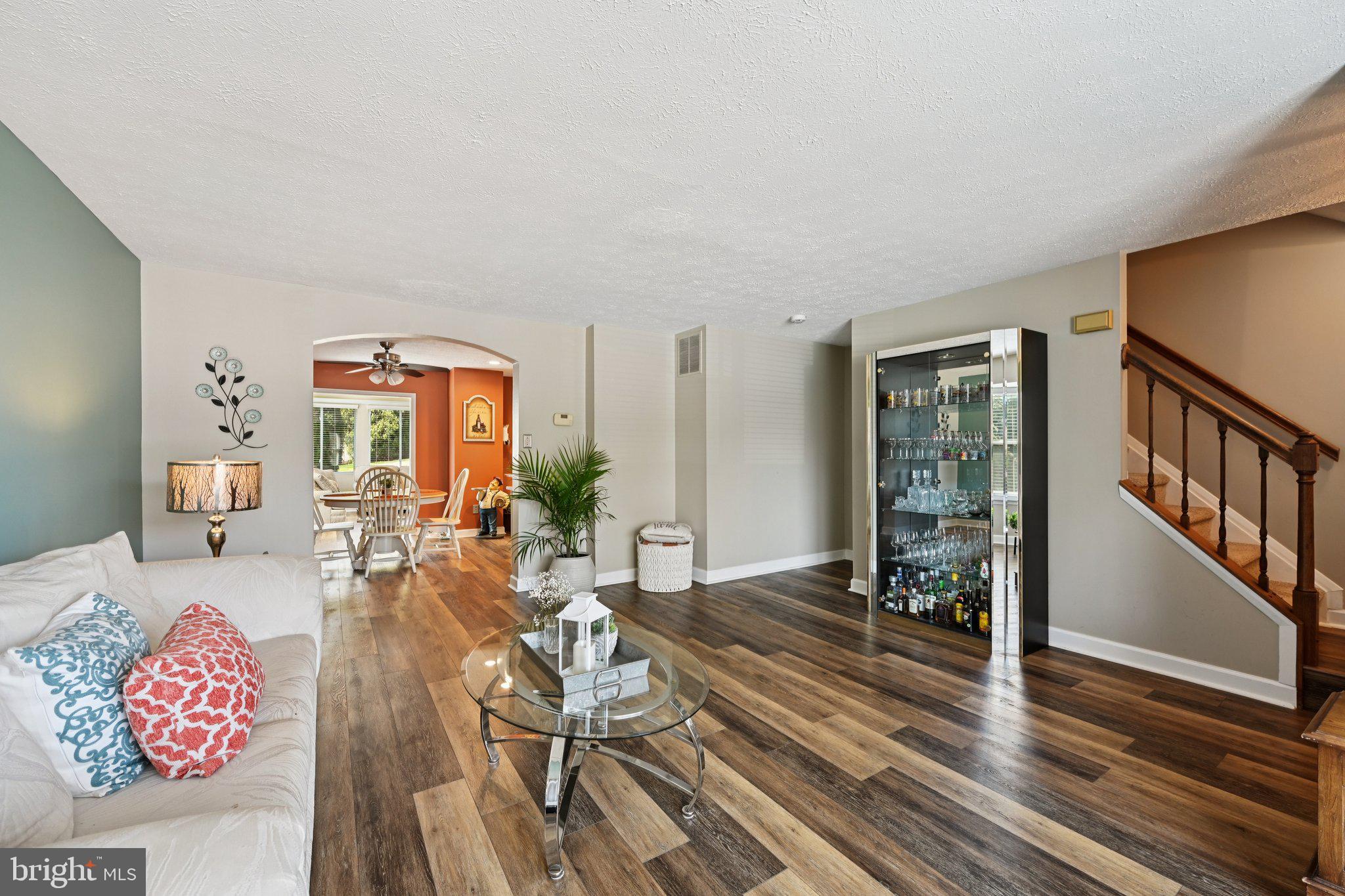 46 Bellfalls Way Baltimore, MD 21236 - Photo 15 of 65 a living room with furniture and a floor to ceiling window