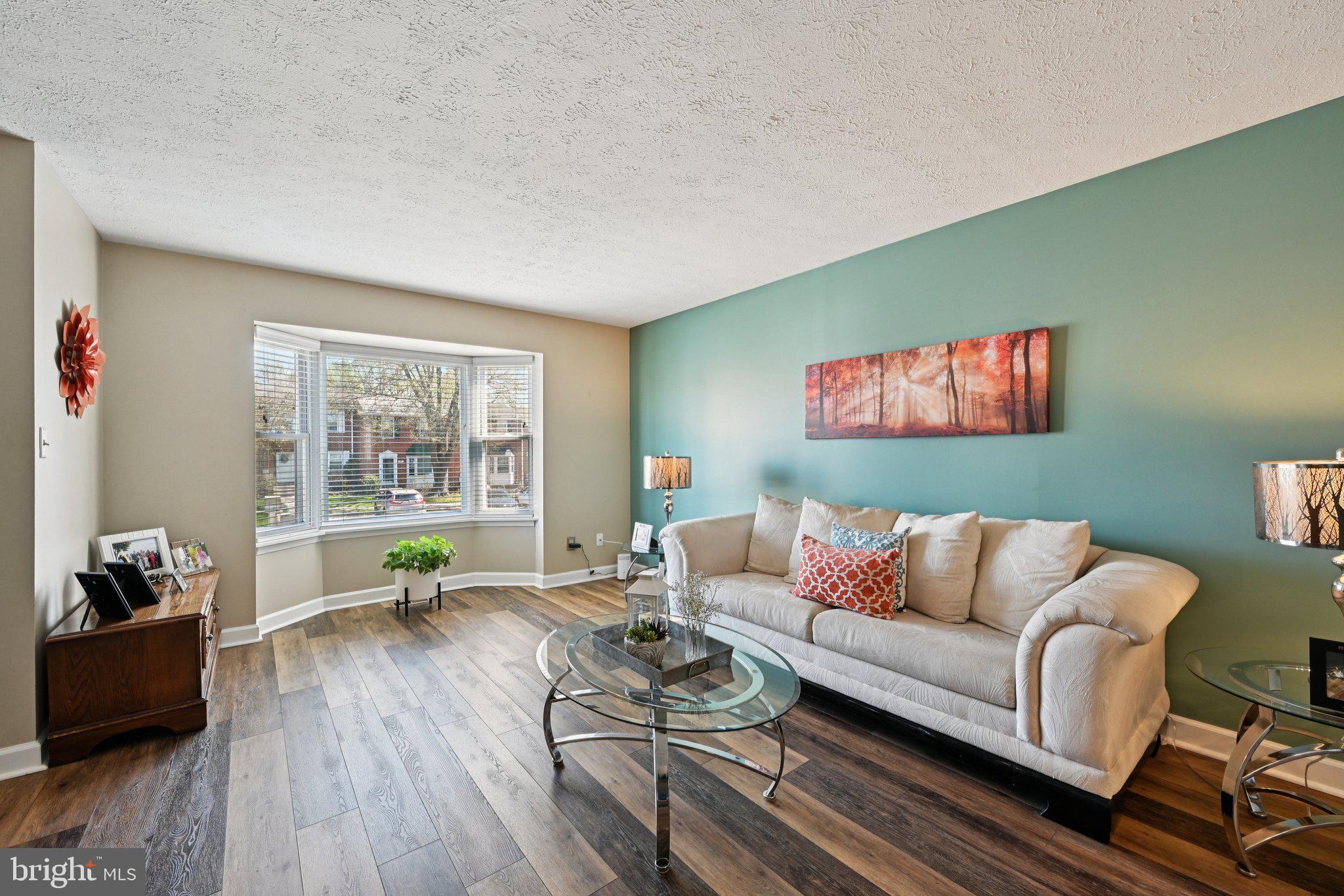 46 Bellfalls Way Baltimore, MD 21236 - Photo 17 of 65 a living room with furniture and a wooden floor