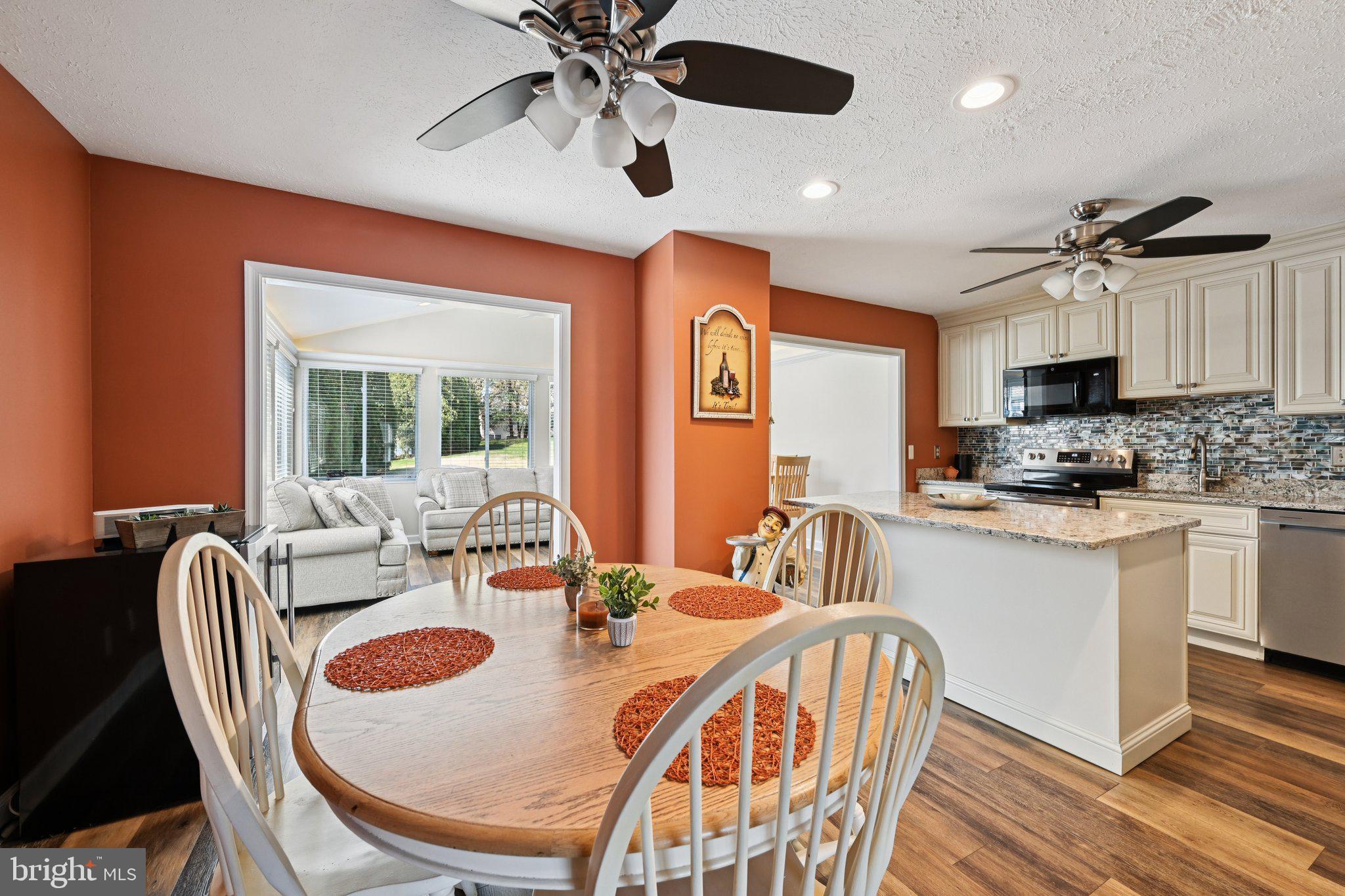 46 Bellfalls Way Baltimore, MD 21236 - Photo 22 of 65 a view of a dining room with furniture window and wooden floor