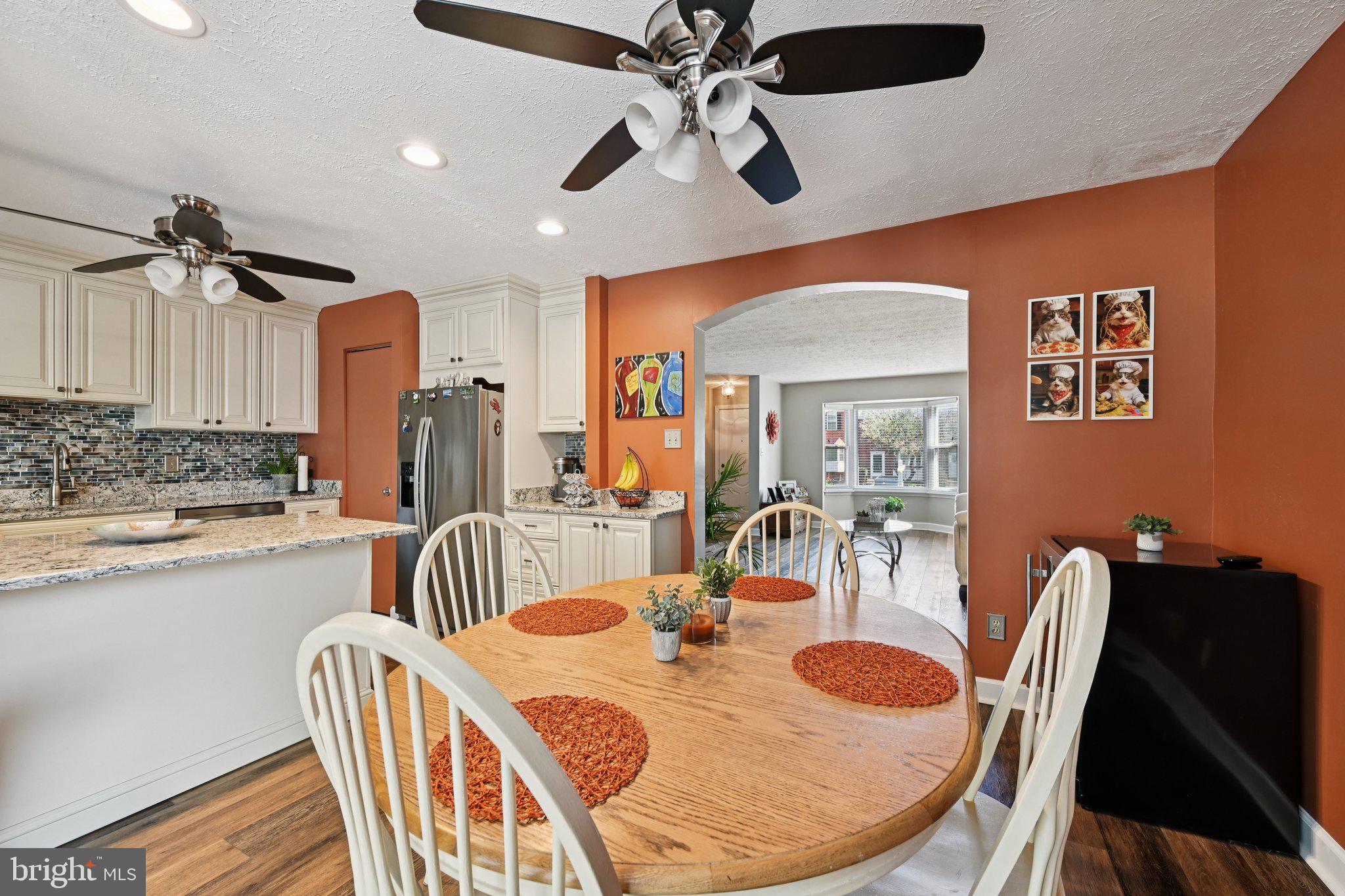 46 Bellfalls Way Baltimore, MD 21236 - Photo 24 of 65 a dining room with furniture and a chandelier fan