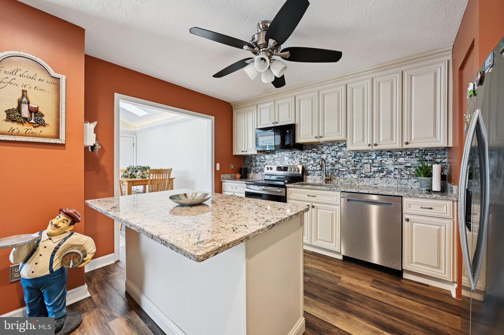 46 Bellfalls Way Baltimore, MD 21236 - Photo 26 of 65 a kitchen with stainless steel appliances granite countertop a sink stove and refrigerator