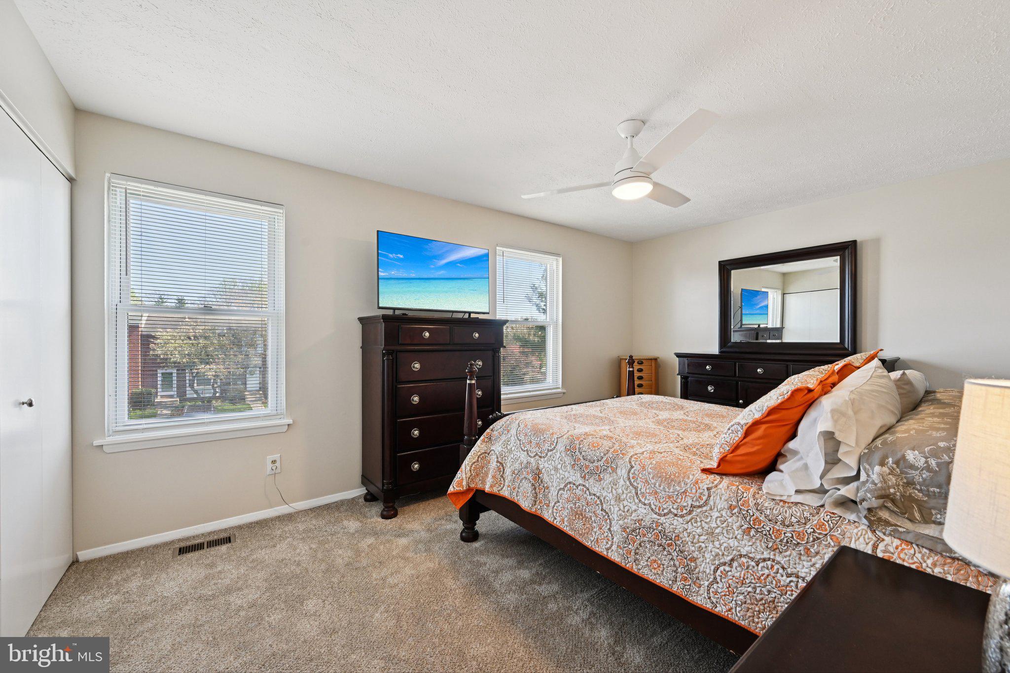 46 Bellfalls Way Baltimore, MD 21236 - Photo 30 of 65 a bedroom with a bed and a dresser