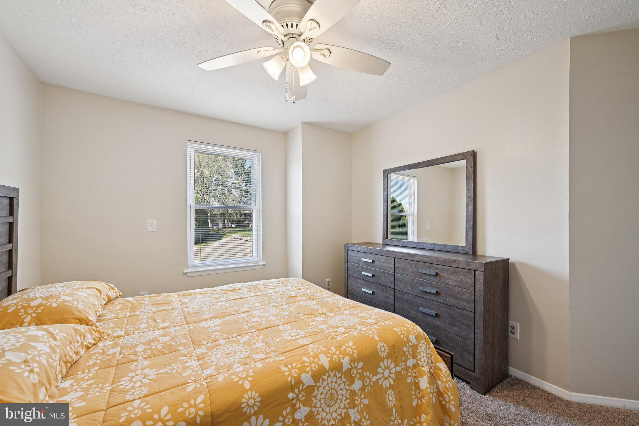 46 Bellfalls Way Baltimore, MD 21236 - Photo 36 of 65 a bedroom with a bed and a dresser