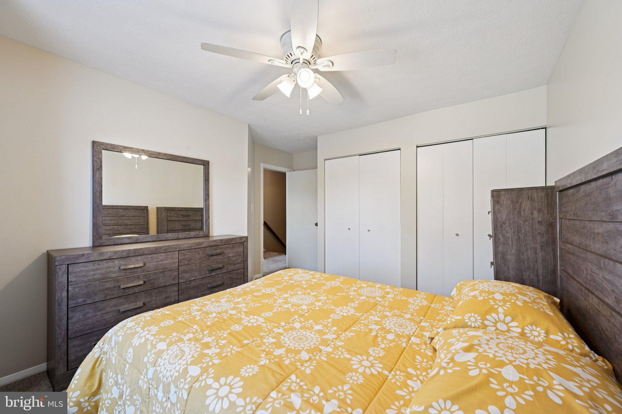 46 Bellfalls Way Baltimore, MD 21236 - Photo 37 of 65 a bedroom with a bed and a dresser