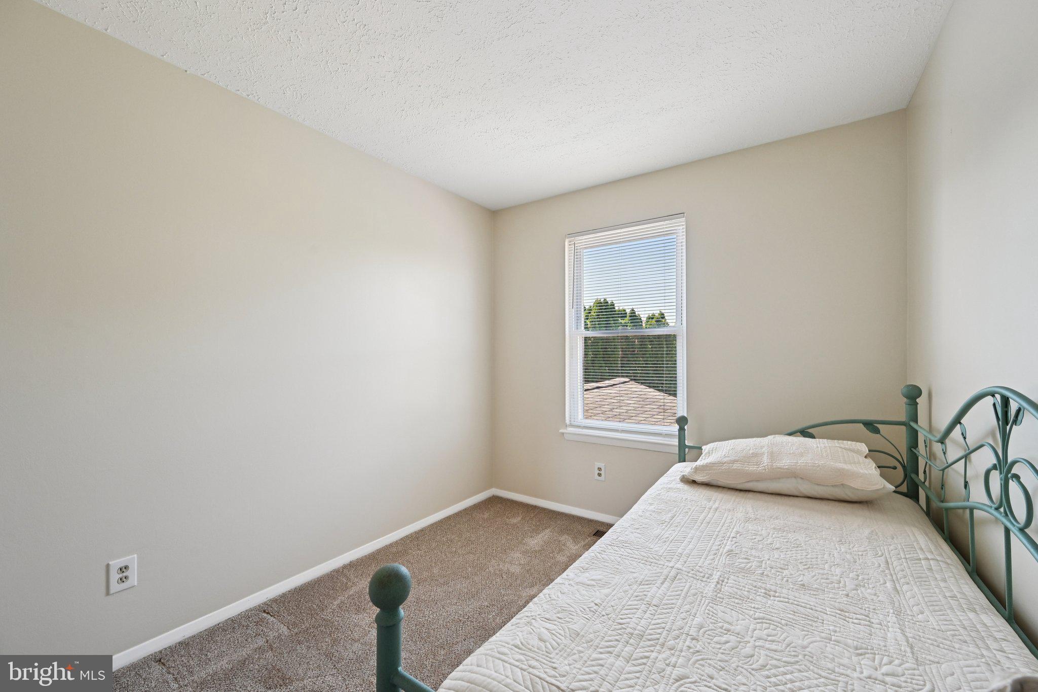 46 Bellfalls Way Baltimore, MD 21236 - Photo 39 of 65 a bedroom with a bed and window