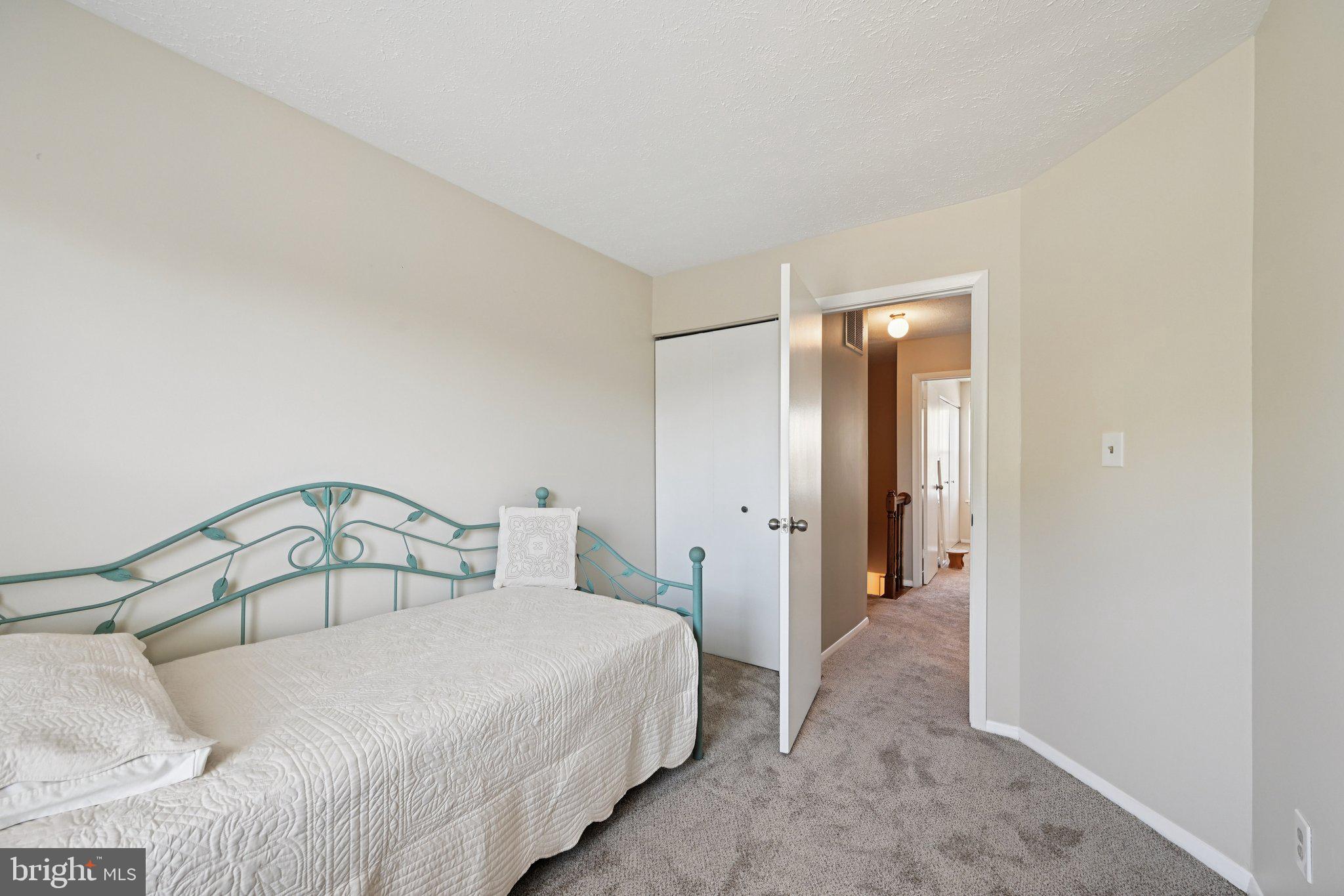 46 Bellfalls Way Baltimore, MD 21236 - Photo 40 of 65 a bedroom with a bed and a mirror