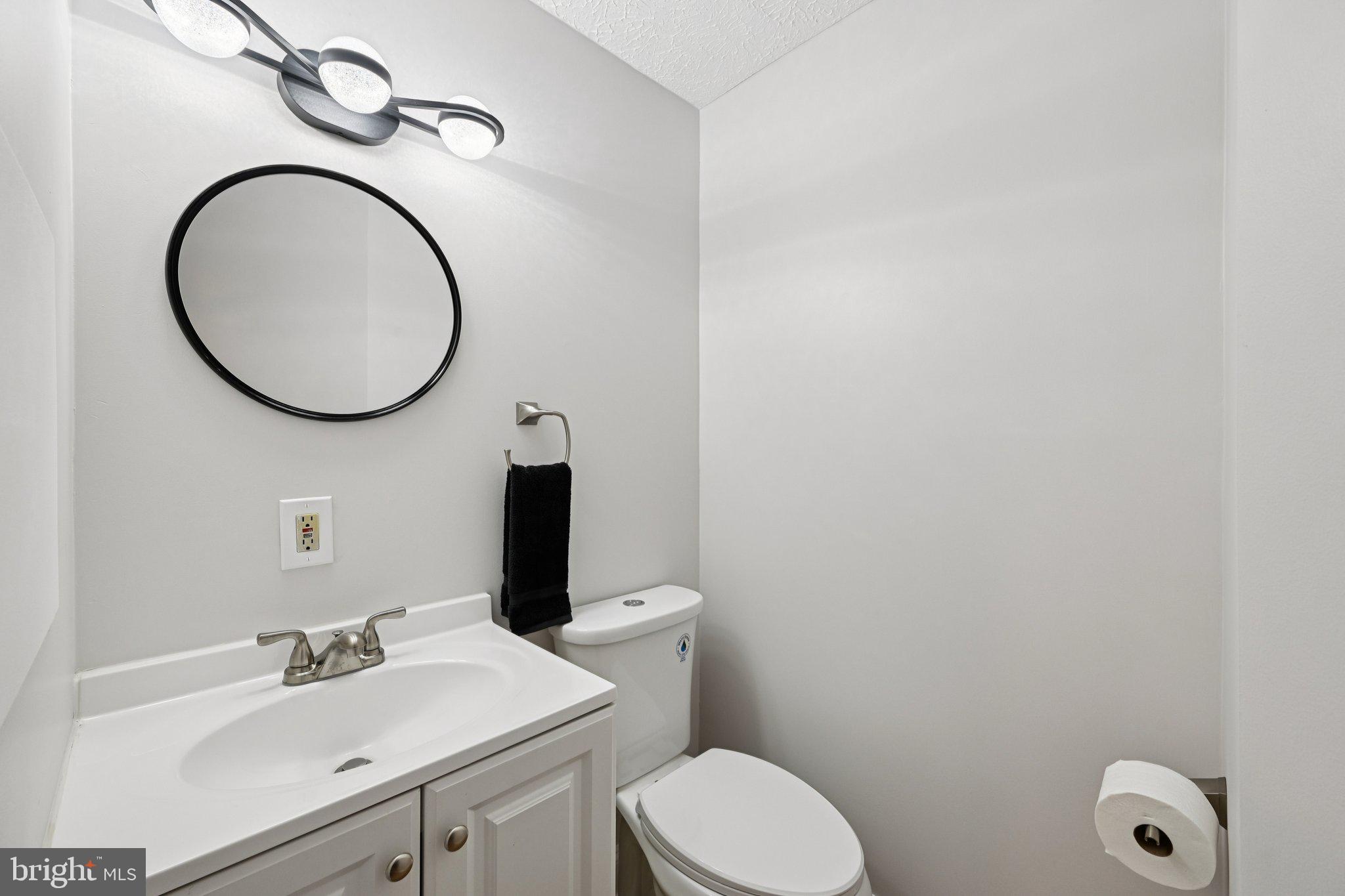46 Bellfalls Way Baltimore, MD 21236 - Photo 42 of 65 a bathroom with a toilet sink vanity and mirror