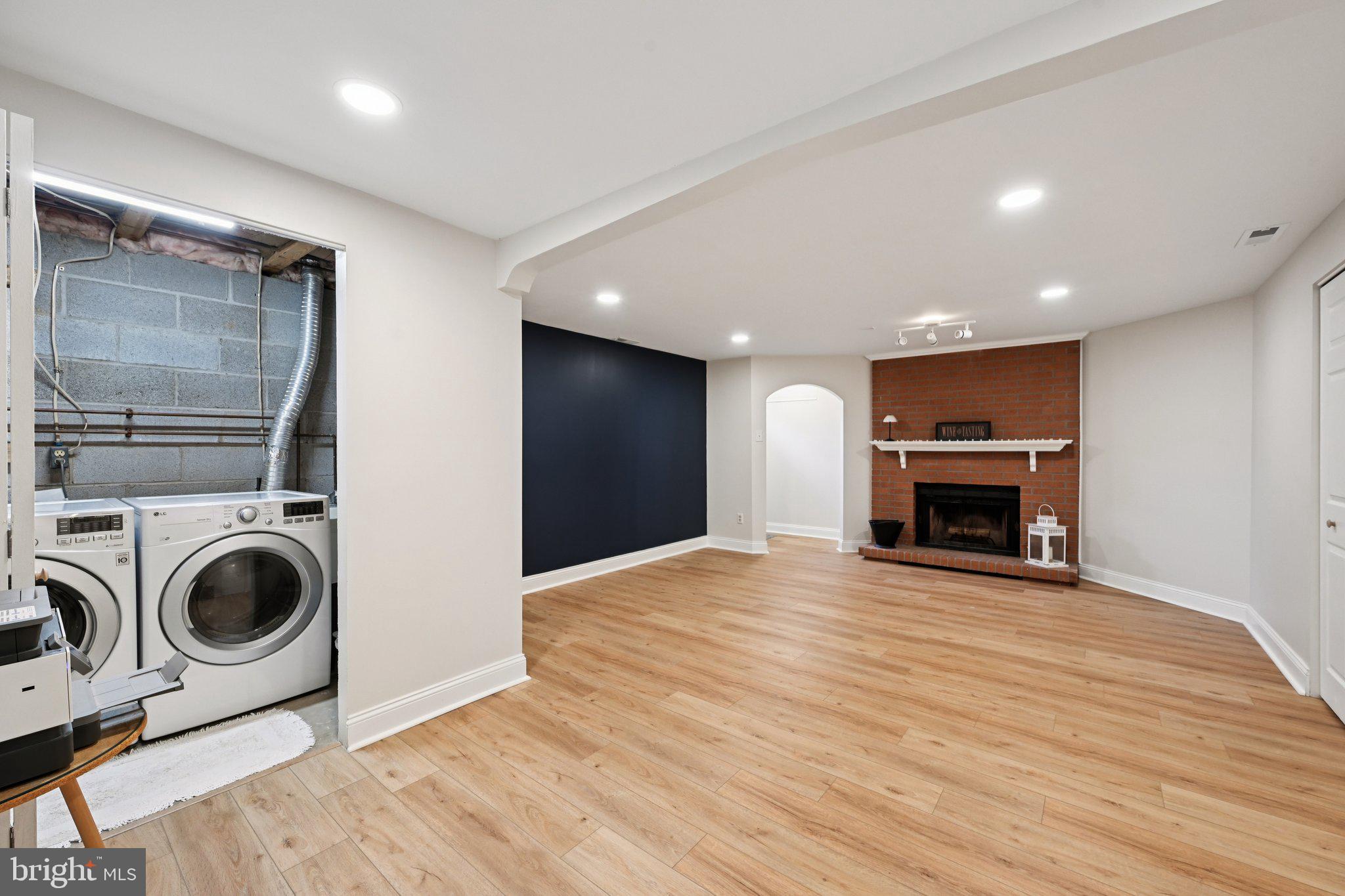 46 Bellfalls Way Baltimore, MD 21236 - Photo 44 of 65 a view of an empty room with wooden floor and a fireplace