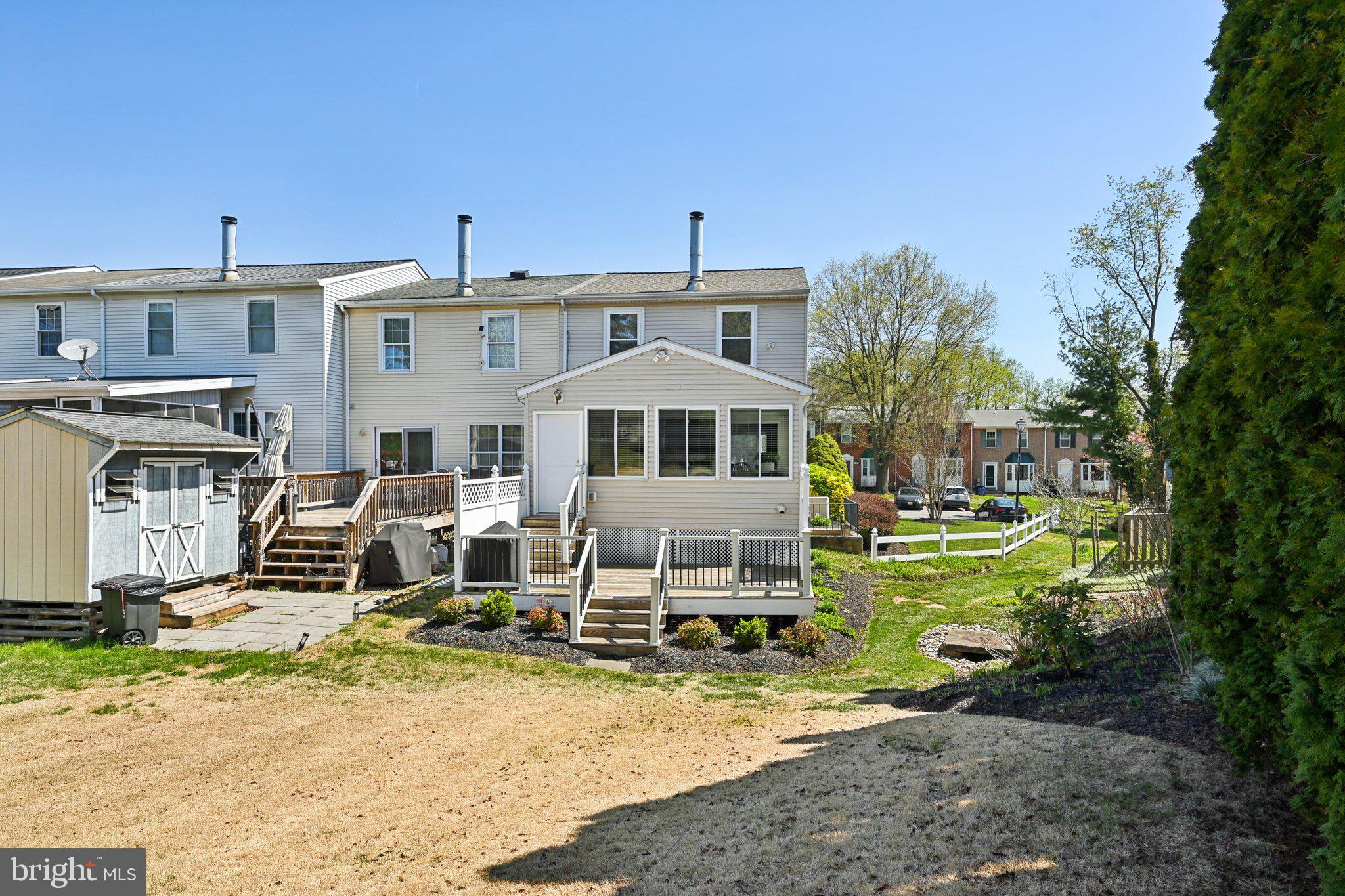46 Bellfalls Way Baltimore, MD 21236 - Photo 50 of 65 a front view of a house with a yard table and chairs