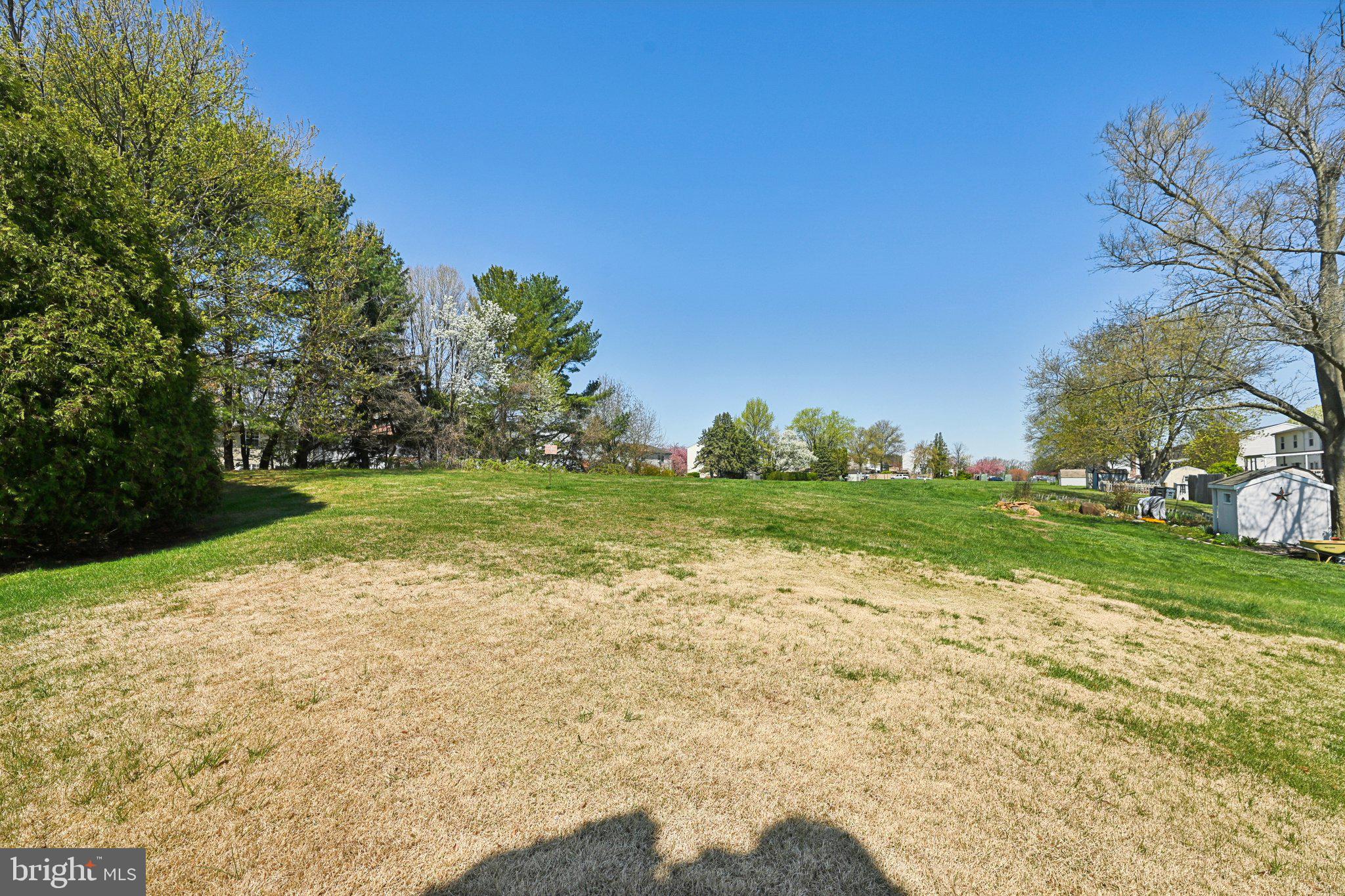 46 Bellfalls Way Baltimore, MD 21236 - Photo 52 of 65 a view of a grassy field with an trees