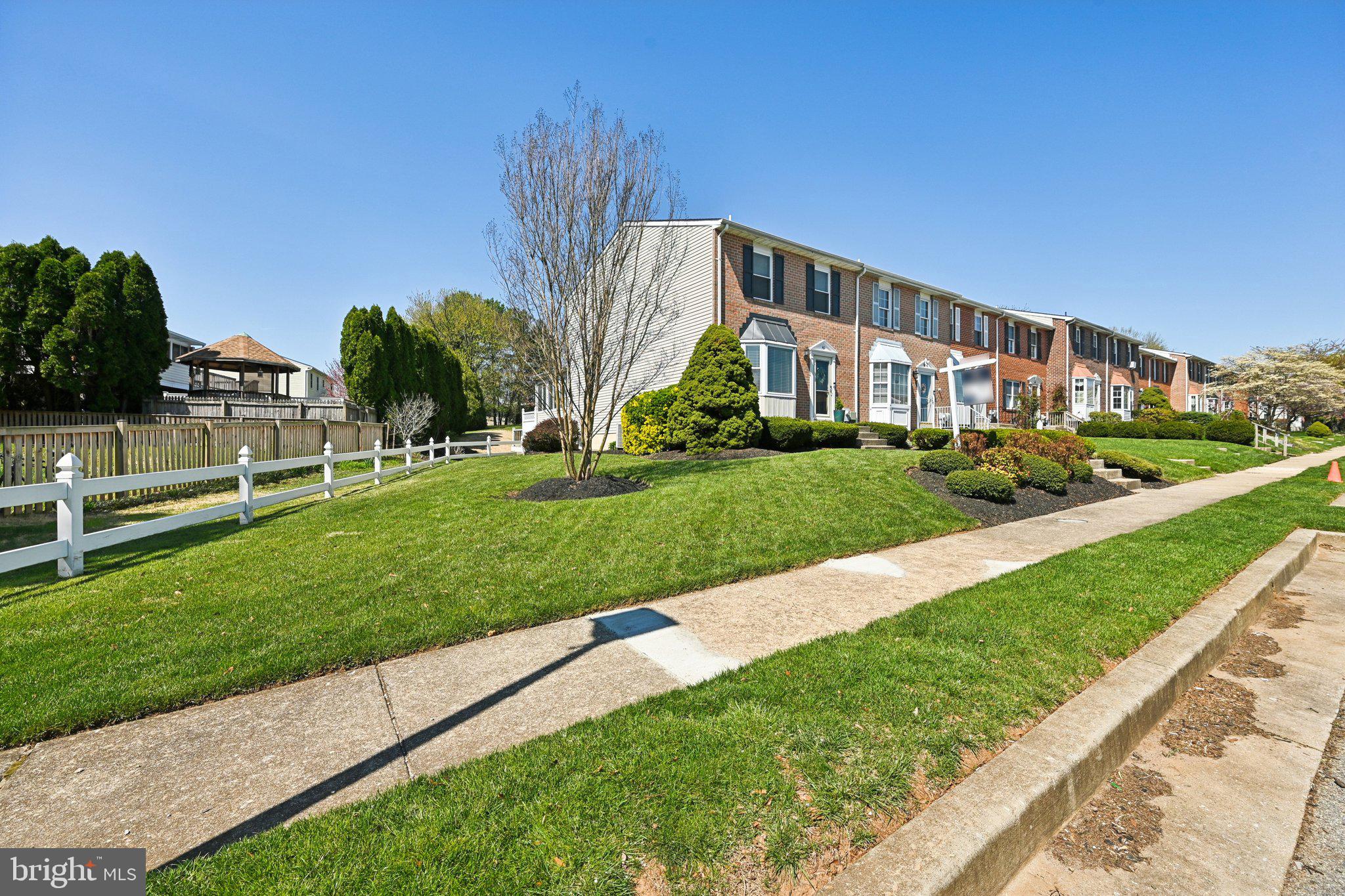 46 Bellfalls Way Baltimore, MD 21236 - Photo 59 of 65 a view of a big building with a big yard and plants