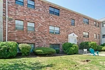 a brick building with a yard
