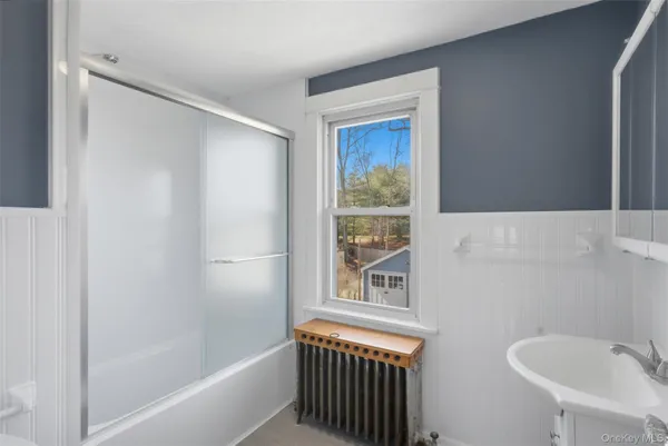 a bathroom with a bathtub and a sink