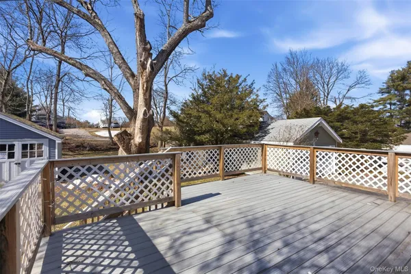 a view of a balcony with wooden fence