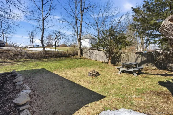 a view of a backyard with large trees