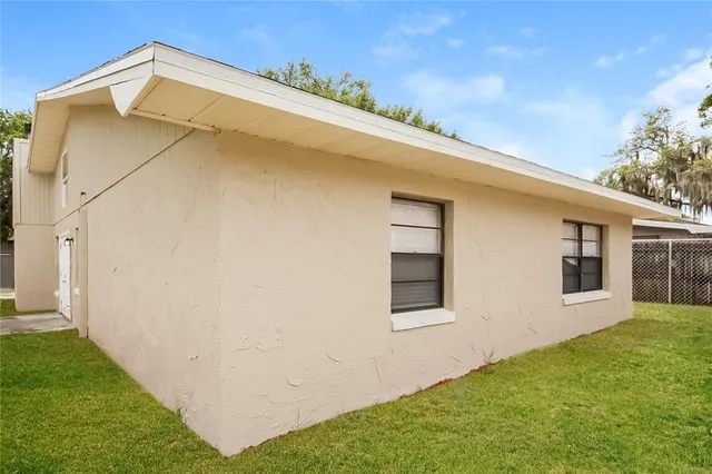 a view of a backyard of the house