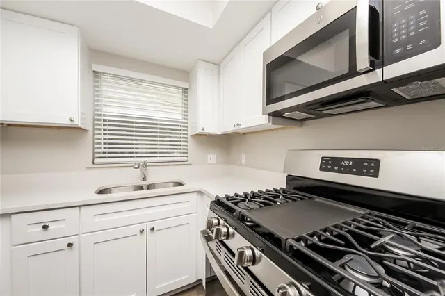 a kitchen with a stove and a microwave