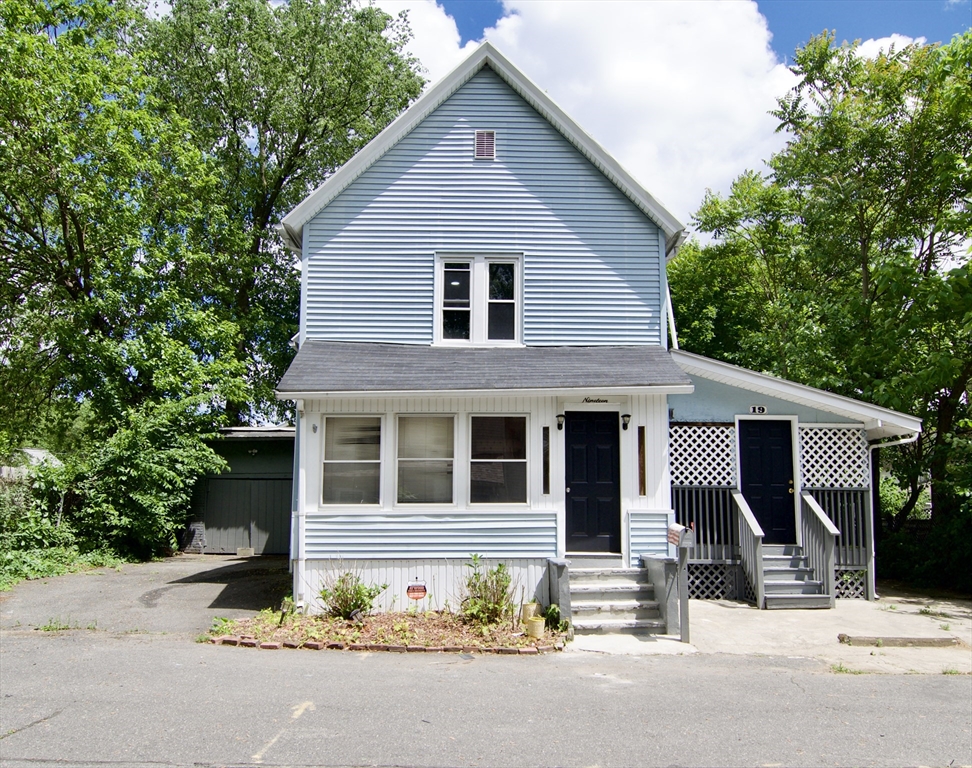 19 Greene Place Springfield, MA 01109 - Photo 1 of 36 a front view of a house with a garage