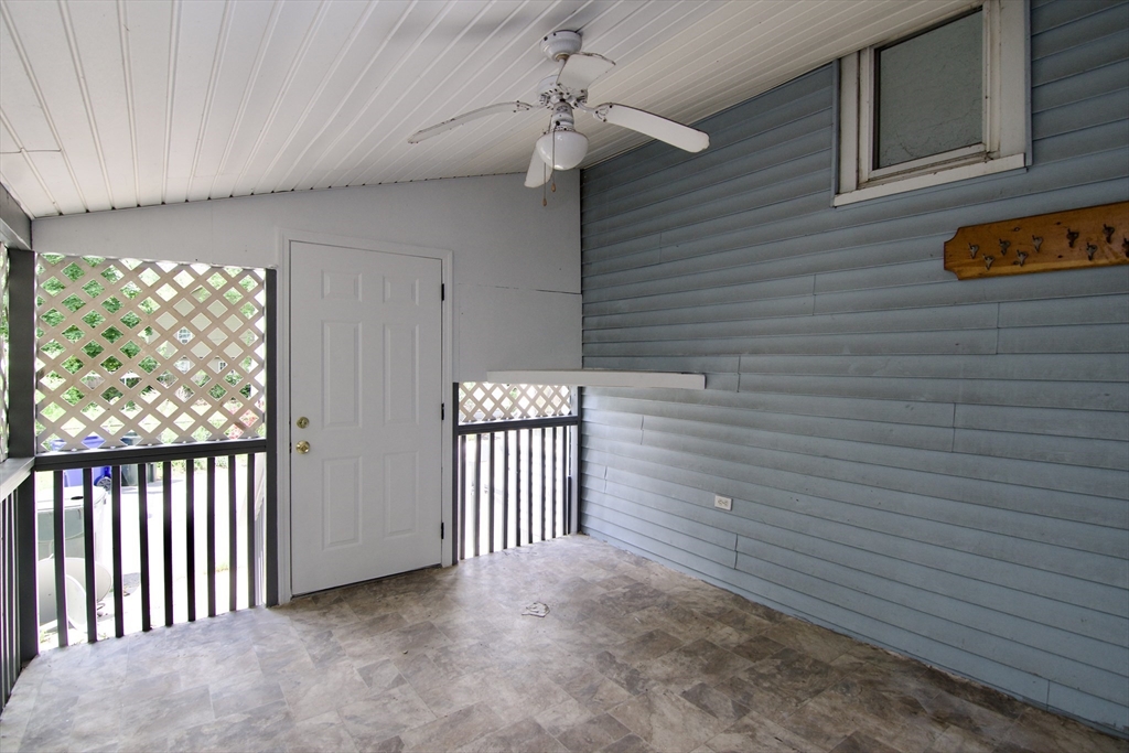 19 Greene Place Springfield, MA 01109 - Photo 11 of 36 a view of a porch with a door and wooden floor