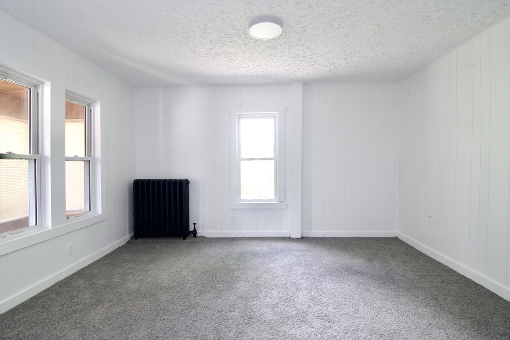 19 Greene Place Springfield, MA 01109 - Photo 15 of 36 an empty room with a window