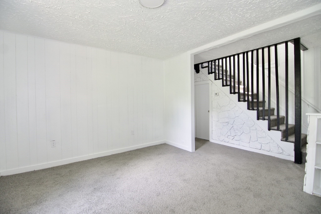 19 Greene Place Springfield, MA 01109 - Photo 16 of 36 a view of a hallway with staircase