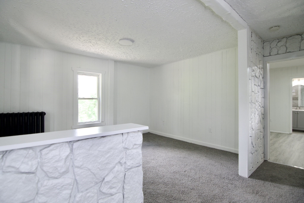 19 Greene Place Springfield, MA 01109 - Photo 20 of 36 a view of an empty room with a window