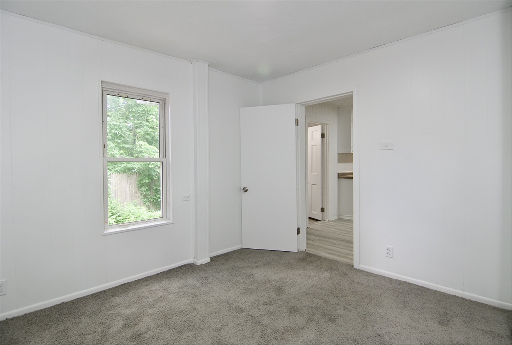19 Greene Place Springfield, MA 01109 - Photo 23 of 36 an empty room with windows and closet