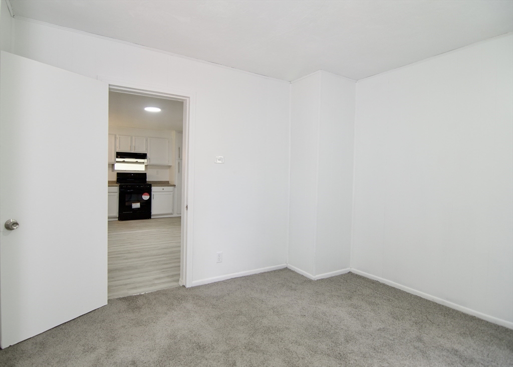 19 Greene Place Springfield, MA 01109 - Photo 24 of 36 an empty room with an empty space