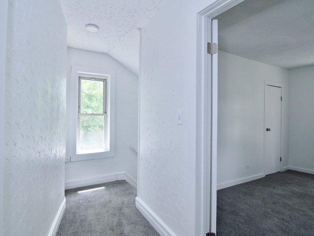 19 Greene Place Springfield, MA 01109 - Photo 25 of 36 a view of an empty room with a window