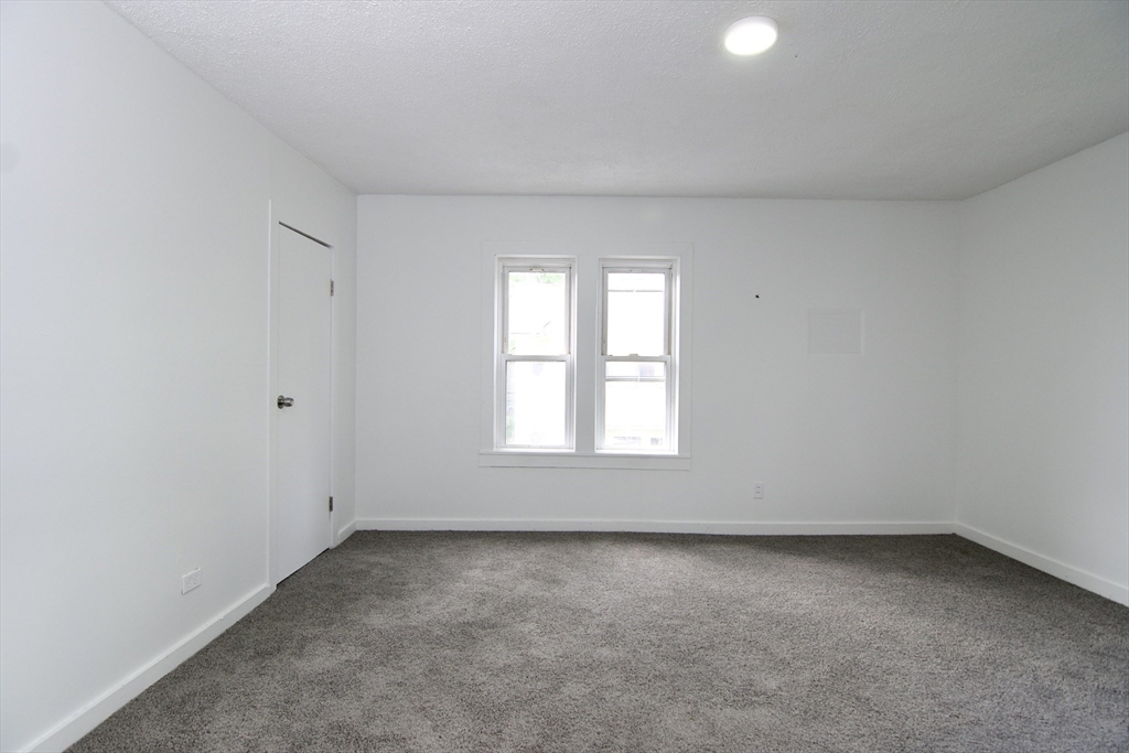 19 Greene Place Springfield, MA 01109 - Photo 26 of 36 an empty room with a window