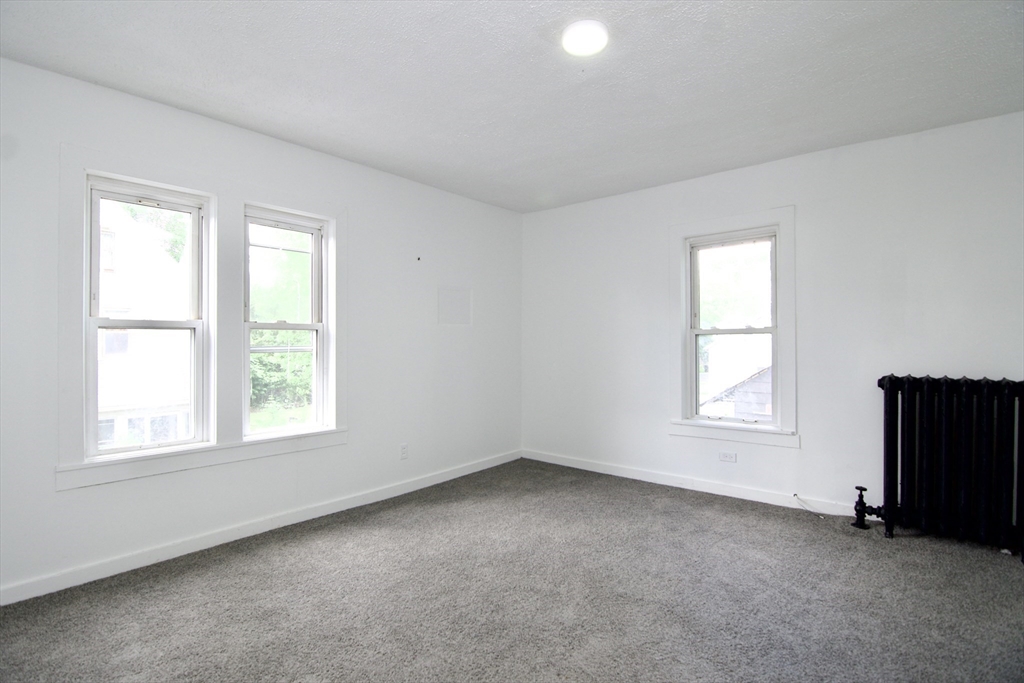 19 Greene Place Springfield, MA 01109 - Photo 27 of 36 an empty room with windows