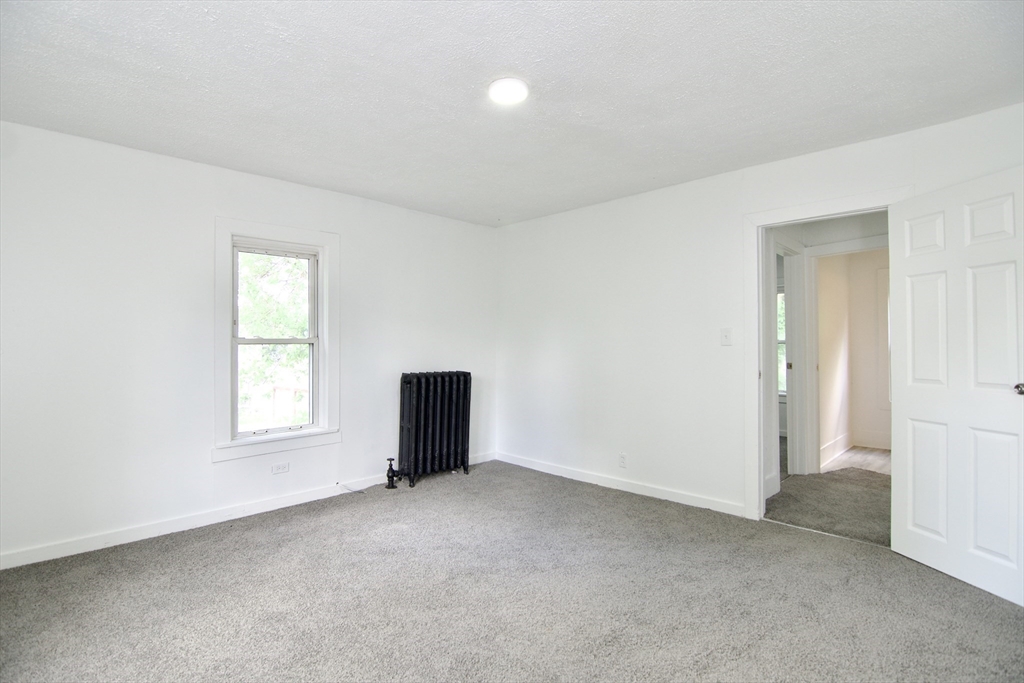 19 Greene Place Springfield, MA 01109 - Photo 29 of 36 an empty room with windows and closet