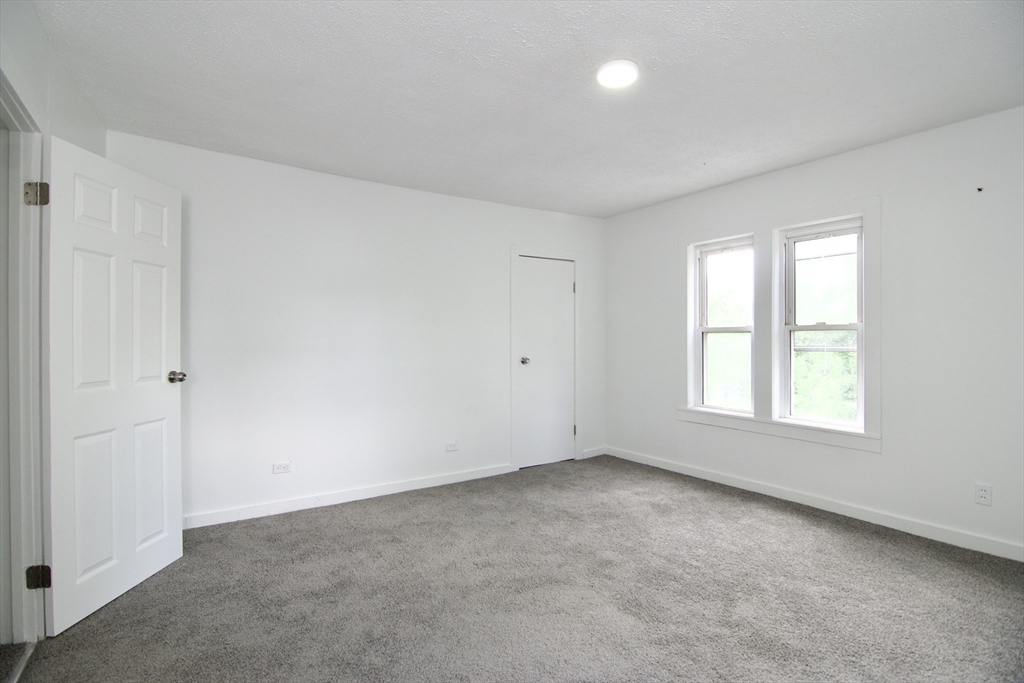 19 Greene Place Springfield, MA 01109 - Photo 30 of 36 an empty room with a window