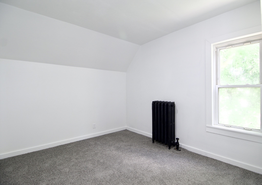 19 Greene Place Springfield, MA 01109 - Photo 34 of 36 an empty room with a window
