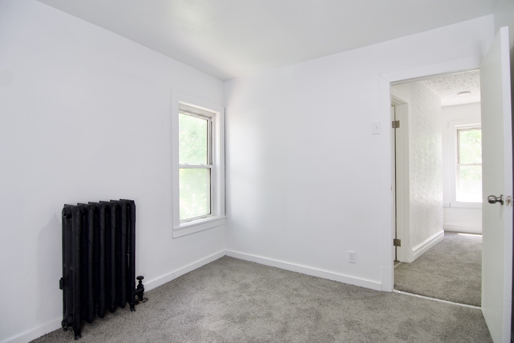 19 Greene Place Springfield, MA 01109 - Photo 36 of 36 an empty room with windows and closet