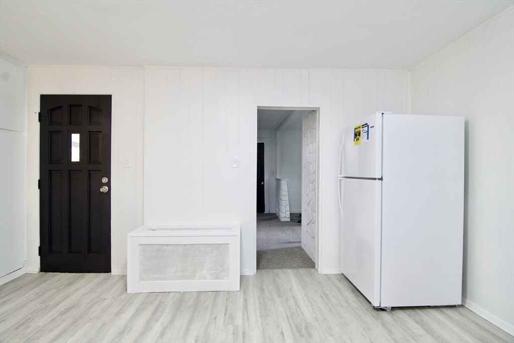 19 Greene Place Springfield, MA 01109 - Photo 6 of 36 a view of a hallway with wooden floor