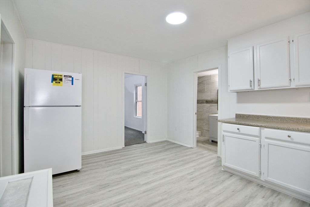 19 Greene Place Springfield, MA 01109 - Photo 8 of 36 a kitchen with a refrigerator and a stove top oven
