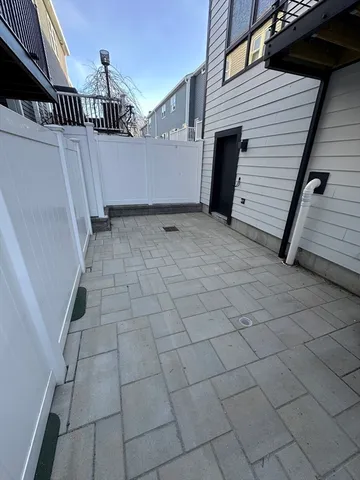 a view of a balcony with wooden floor