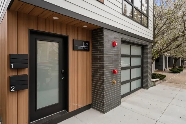 a front view of a house with parking