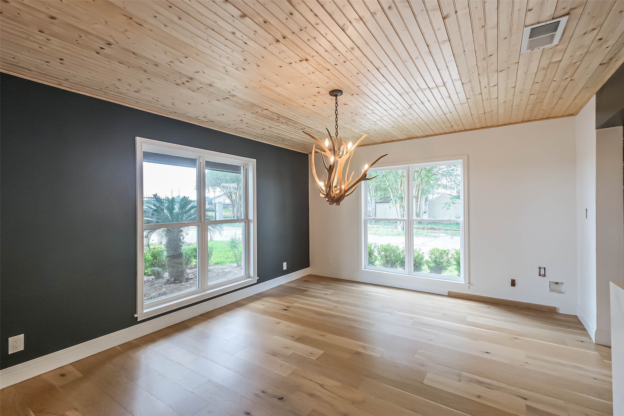 11019 Clodine Road Sugar Land, TX 77498 - Photo 10 of 39 an empty room with wooden floor and windows