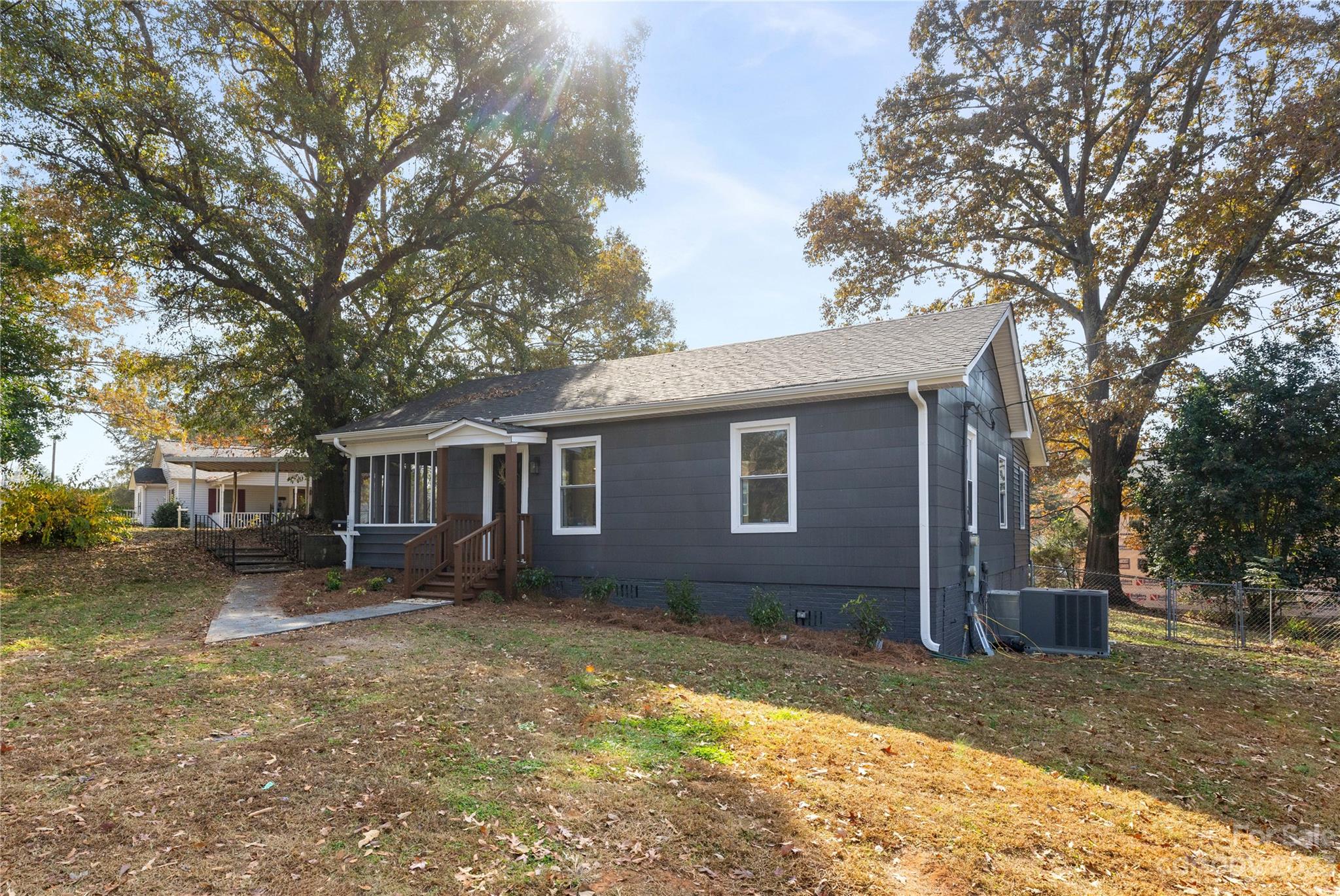 201 Hicks Circle Mount Holly, NC 28120 - Photo 2 of 23 a house that has a tree in front of it