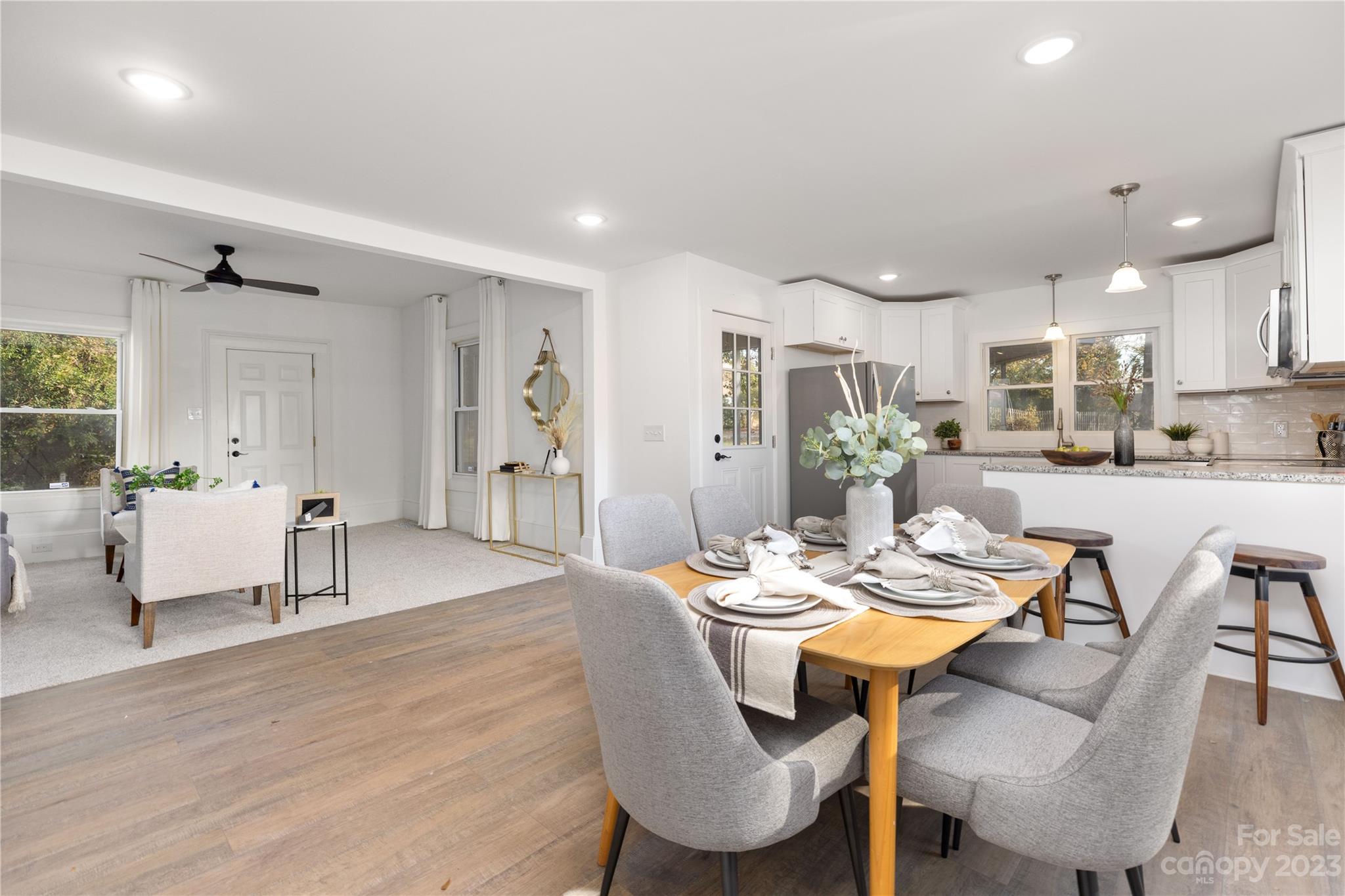 201 Hicks Circle Mount Holly, NC 28120 - Photo 7 of 23 a view of a dining room with furniture and wooden floor