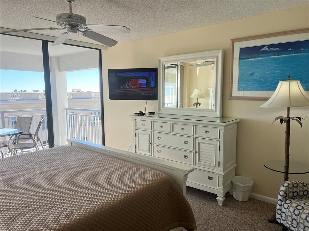 1001 Point Of Rocks Road, Unit 609 Sarasota, FL 34242 - Photo 16 of 41 a bedroom with a bed a stove and a window