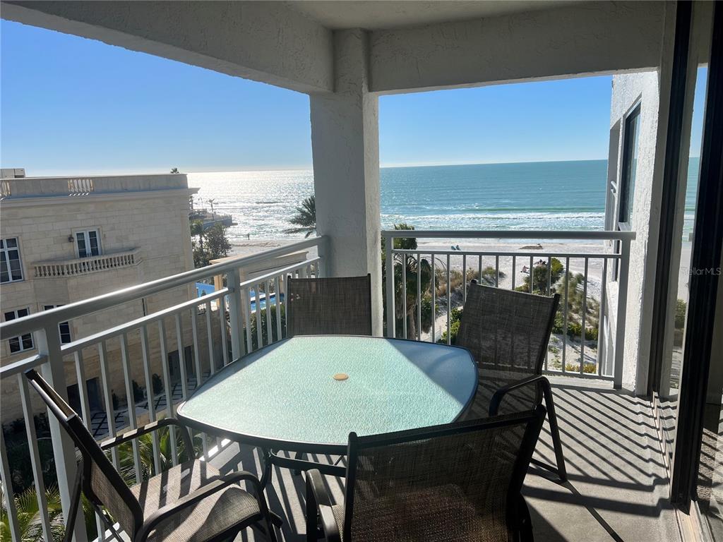 1001 Point Of Rocks Road, Unit 609 Sarasota, FL 34242 - Photo 2 of 41 a view of a balcony with table and chairs