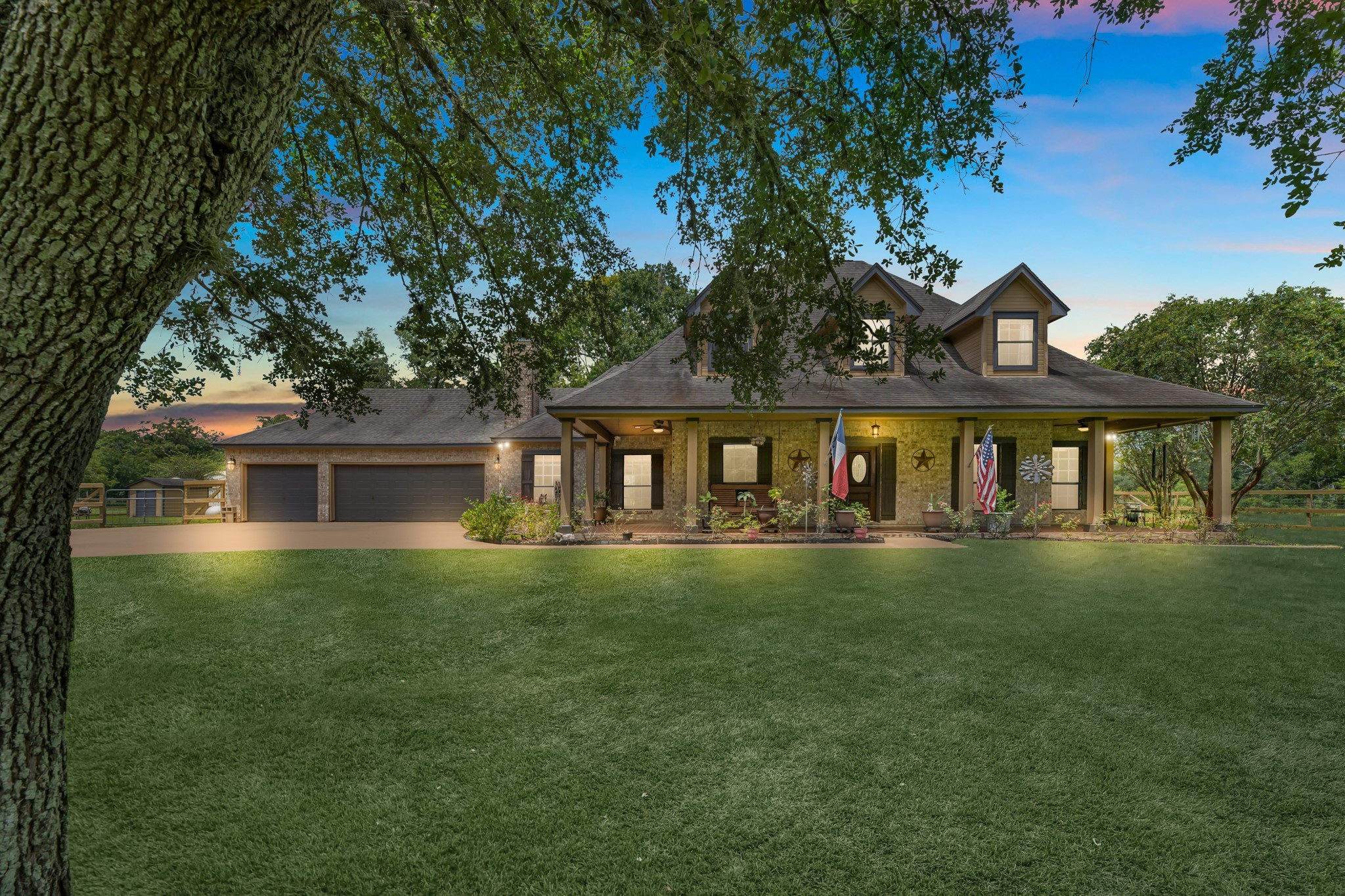 a front view of house with yard and green space