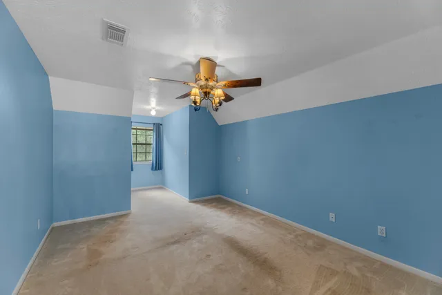 a bathroom with a tub sink and a window
