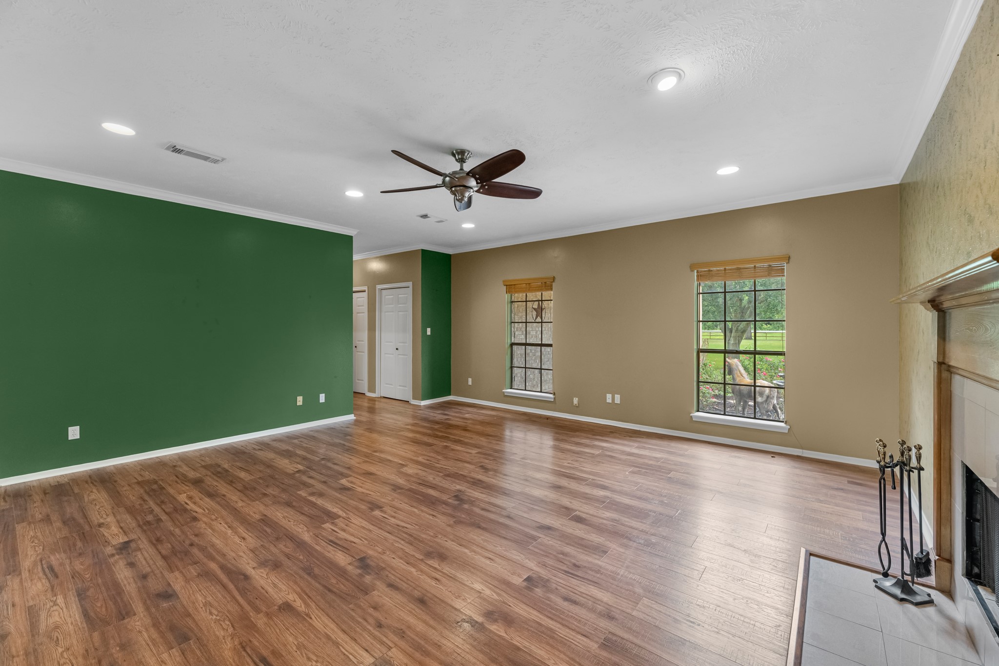 17126 County Road 39 Rosharon, TX 77583 - Photo 36 of 47 a view of an empty room with window and wooden floor