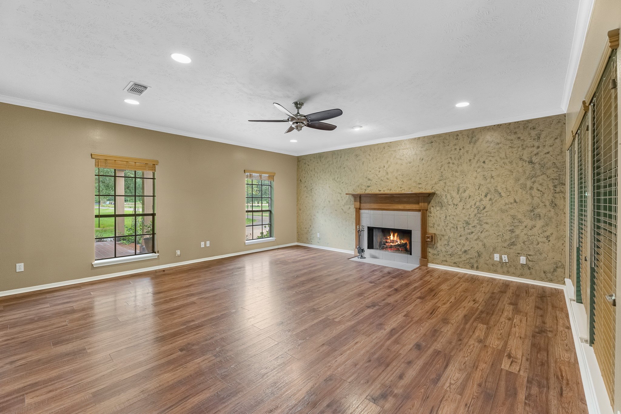 17126 County Road 39 Rosharon, TX 77583 - Photo 37 of 47 a view of an empty room with a fireplace and a window