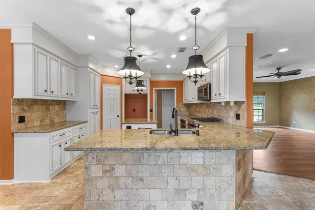 a view of a house with a backyard